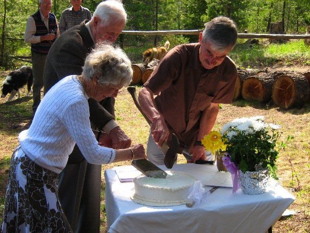 using a cleaver and an axe to cut the wedding cake | Korena in the Kitchen