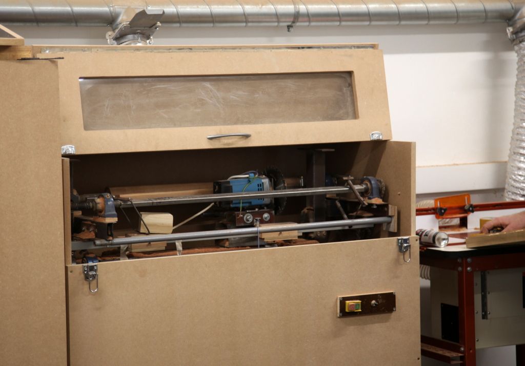 John Smith's old neck shaping jig, now in a nice (and health and safety approved!) new cabinet. The standard width Gordon Smith necks are rough cut on this machine and then hand finished John Smith's old neck shaping jig, now in a nice (and health and safety approved!) new cabinet. The standard width Gordon Smith necks are rough cut on this machine and then hand finished