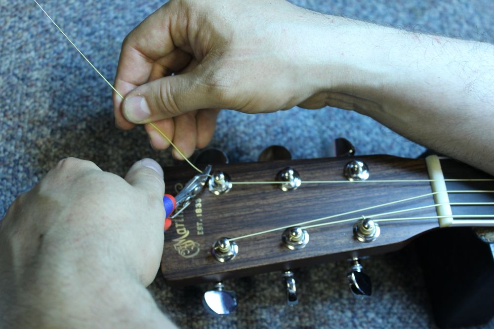 How to restring a steel string acoustic guitar step 10