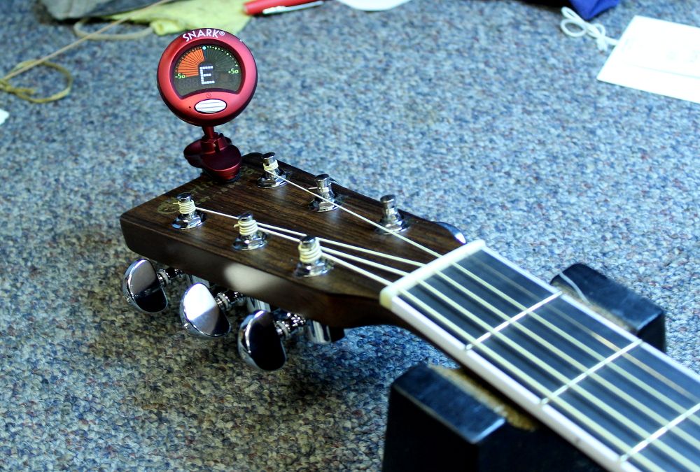 How to restring a steel string acoustic guitar step 11