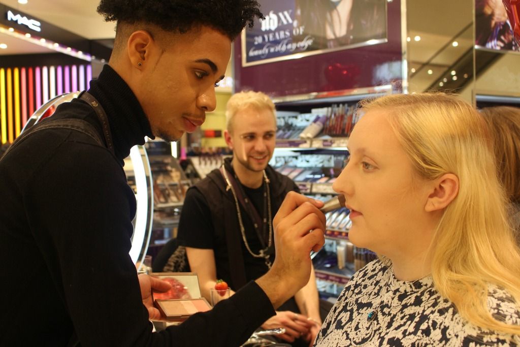 picture of me having my foundation applied by one of the urban decay team
