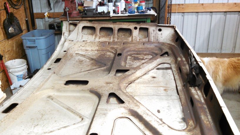 updated - surface rust between skin and frame of hood - The