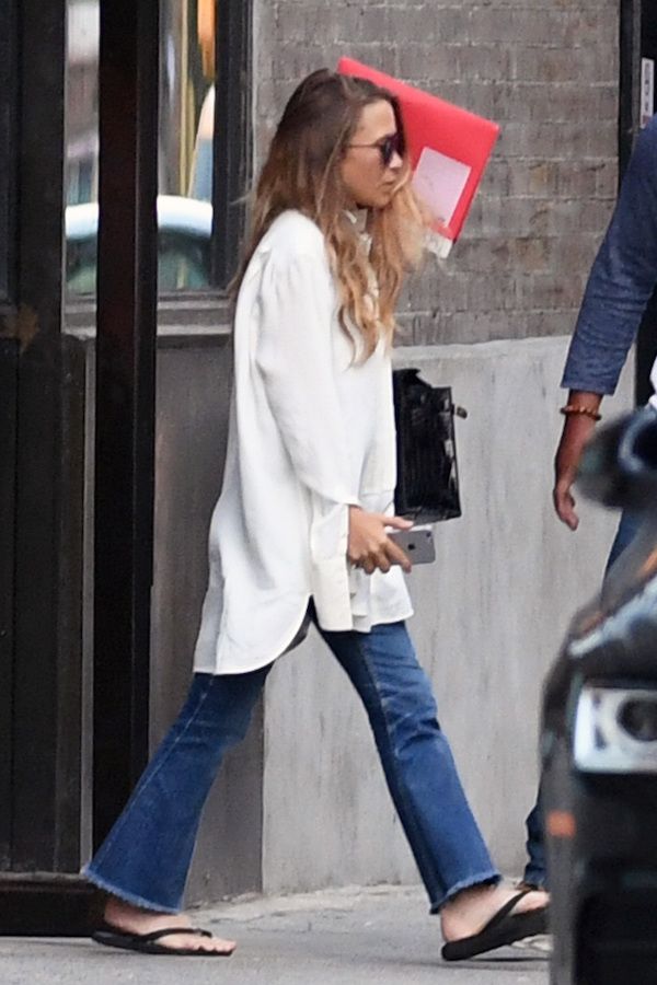 Olsens Anonymous Blog Mary Kate Olsen Twins Style Aviator Sunglasses Long Wavy Hair Oversized White Button Down Shirt Frayed Raw Hem Flared Jeans Denim Flip Flip Sandals