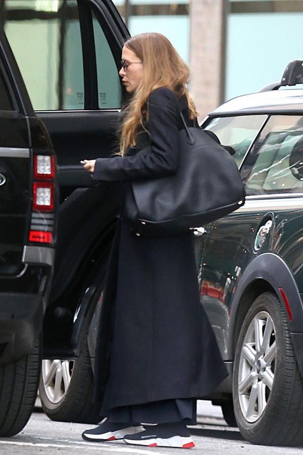 Olsens Anonymous Fashion Blog Mary Kate Olsen Twins Style Long Coat Wide Leg Pants Balenciaga Speed Sneakers It Shoes All Black