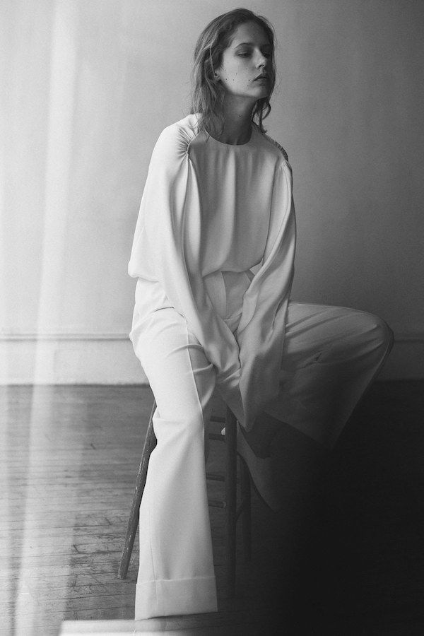 Olsens Anonymous Fashion Blog The Row Resort 2018 Collection Scrunch Shoulder Long Sleeve Bell Sleeve Wide Leg Pleated Pants All White Loafer Flats photo Olsens-Anonymous-Fashion-Blog-The-Row-Resort-2018-Collection-Scrunch-Shoulder-Long-Sleeve-Bell-Sleeve-Wide-Leg-Pleated-Pants-All-White-Loafer-Flats.jpg