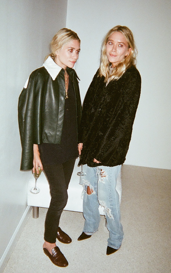 OLSENS ANONYMOUS MKA MARY KATE ASHLEY OLSEN FASHION STYLE BLOG CANDID ELIZABETH AND JAMES SS 2014 PRESENTATION GREEN LEATHER JACKET SHEARLING COLLAR CROPPED BLACK JEANS FLAT BROWN THE ROW SLIP ON FLATS LOAFERS BLACK CURLY LAMB FUR COAT BAGGY DISTRESSED RIPPED DENIM JEANS BLACK PUMPS SATIN WASHED  SILK BUTTON UP SHIRT  VIA WHEN IM NOT NAKED photo OLSENSANONYMOUSMKACANDIDELIZABETHANDJAMESSS2014PRESENTATIONDISTRESSEDDENIM.png