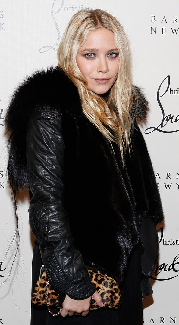 OLSENS ANONYMOUS MK MARY KATE OLSEN FASHION STYLE BLOG CHRISTIAN LOUBOUTIN BARNEYS PARTY FUR VEST QUILTED TEXTURED LEATHER JACKET BLACK DRESS LEOPARD CLASP CLUTCH BAG NUDE MAUVE LIPSTICK LIPS WAVY WAVES HAIR